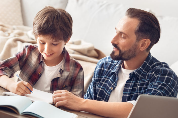 Dad helping son with homework